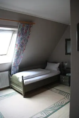 Ein Bett oder Betten in einem Zimmer der Unterkunft Hotel Gasthaus Wangerhof