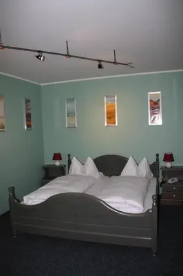Ein Bett oder Betten in einem Zimmer der Unterkunft Hotel Gasthaus Wangerhof