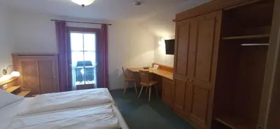Ein Bett oder Betten in einem Zimmer der Unterkunft Gasthaus Aiplspitz
