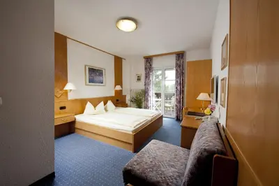 Ein Bett oder Betten in einem Zimmer der Unterkunft Hotel Wittelsbacher Hof