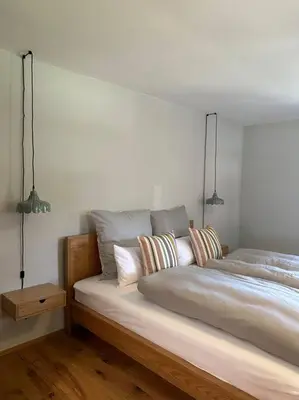 Ein Bett oder Betten in einem Zimmer der Unterkunft Traumurlaub auf dem Brandmanngut