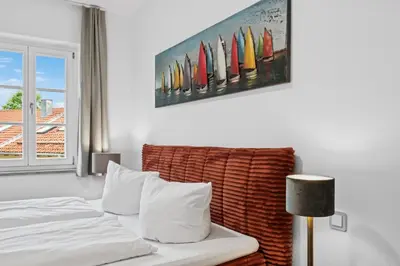 Ein Bett oder Betten in einem Zimmer der Unterkunft Vaicun Stays - Stilvolle Apartments am Tegernsee