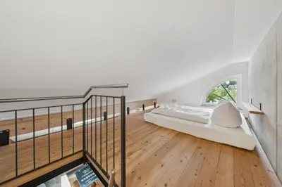 Ein Bett oder Betten in einem Zimmer der Unterkunft Vaicun Stays - Stilvolle Apartments am Tegernsee