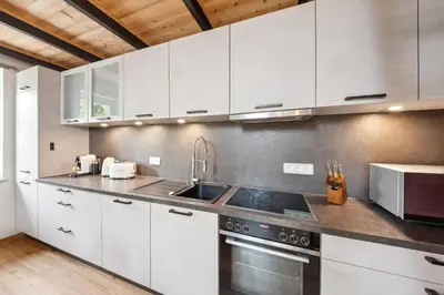 Küche/Küchenzeile in der Unterkunft Vaicun Stays - Stilvolle Apartments am Tegernsee