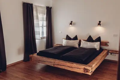 Ein Bett oder Betten in einem Zimmer der Unterkunft Chalet-Apartments Am Schmiedhof
