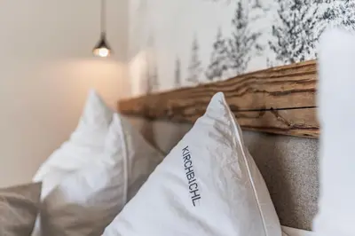 Ein Bett oder Betten in einem Zimmer der Unterkunft DAS KIRCHBICHL - stylisch lässig, mit eigener Sauna