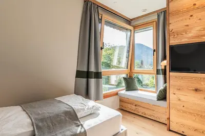 Ein Bett oder Betten in einem Zimmer der Unterkunft DAS KIRCHBICHL - stylisch lässig, mit eigener Sauna