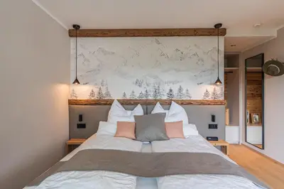 Ein Bett oder Betten in einem Zimmer der Unterkunft DAS KIRCHBICHL - stylisch lässig, mit eigener Sauna