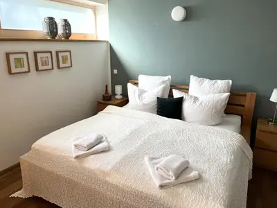 Ein Bett oder Betten in einem Zimmer der Unterkunft Atelier Seeshaupt