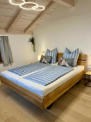 Ein Bett oder Betten in einem Zimmer der Unterkunft Ferienwohnung Wagner