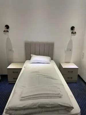 Ein Bett oder Betten in einem Zimmer der Unterkunft Gastpark Hotel