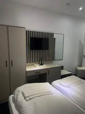 Ein Bett oder Betten in einem Zimmer der Unterkunft Gastpark Hotel