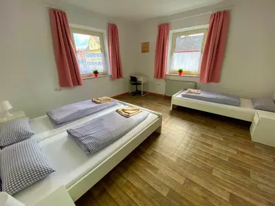 Ein Bett oder Betten in einem Zimmer der Unterkunft Ferienzimmer Fischach