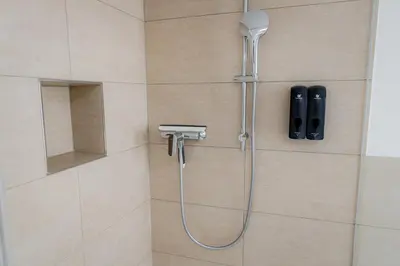 Ein Badezimmer in der Unterkunft Highlight am Stadtplatz Mühldorf - C4S COME4STAY - 2 Zimmer Wohnung I bis zu 5 Gäste