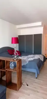 Ein Bett oder Betten in einem Zimmer der Unterkunft Tegernsee Apartment 2 min zum See