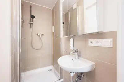 Ein Badezimmer in der Unterkunft Homaris Apartments München Laim