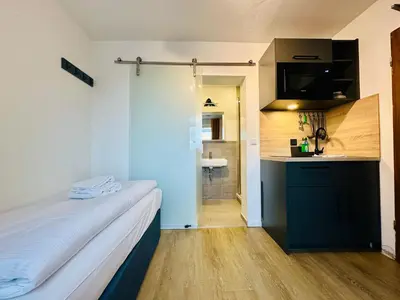 Küche/Küchenzeile in der Unterkunft Homaris Apartments München Laim