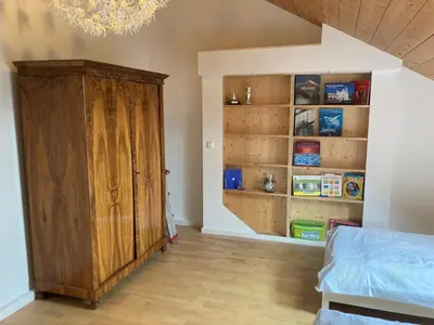 Ein Bett oder Betten in einem Zimmer der Unterkunft Tu Casa Chiemsee Ferienhaus