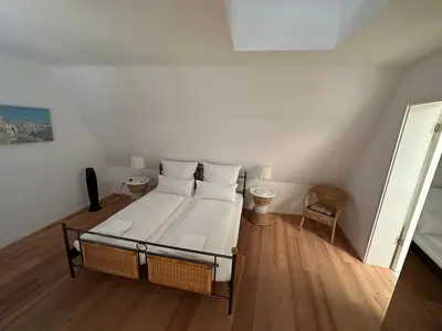 Ein Bett oder Betten in einem Zimmer der Unterkunft Stadtflair Freising - moderne Wohnung im Zentrum