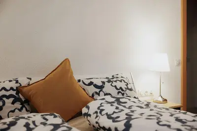 Ein Bett oder Betten in einem Zimmer der Unterkunft CATO Ferienhaus
