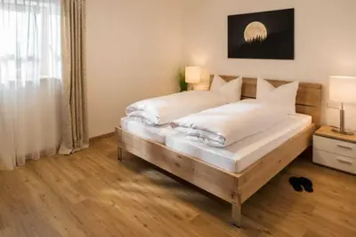 Ein Bett oder Betten in einem Zimmer der Unterkunft Ferienwohnungen Gerold, Kreuth-Reitrain