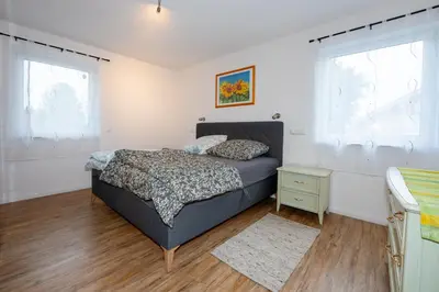 Ein Bett oder Betten in einem Zimmer der Unterkunft Rosenbogen