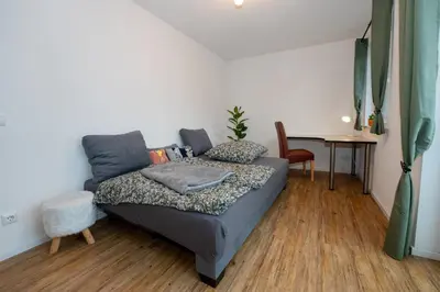 Ein Bett oder Betten in einem Zimmer der Unterkunft Rosenbogen
