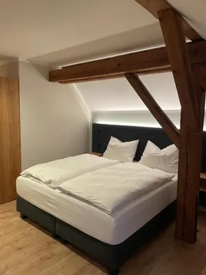 Ein Bett oder Betten in einem Zimmer der Unterkunft Hotel Gasthof Stieglers