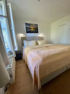 Ein Bett oder Betten in einem Zimmer der Unterkunft Ferienwohnung Prinzenhöhe