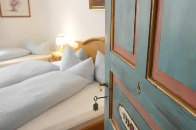 Ein Bett oder Betten in einem Zimmer der Unterkunft Gästehaus Ethiko