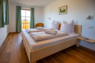 Ein Bett oder Betten in einem Zimmer der Unterkunft Ferienwohnungen zum Nigglhof