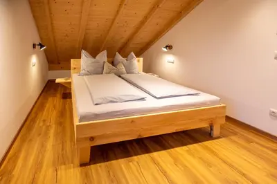 Ein Bett oder Betten in einem Zimmer der Unterkunft Ferienwohnungen zum Nigglhof