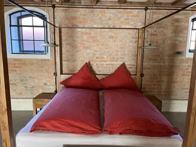 Ein Bett oder Betten in einem Zimmer der Unterkunft Landloft Haus Probst