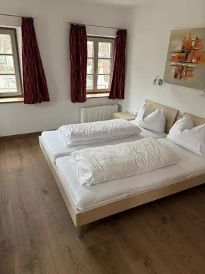 Ein Bett oder Betten in einem Zimmer der Unterkunft Hotel Restaurant Zum Wendelwirt