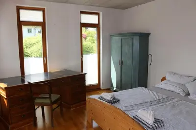 Ein Bett oder Betten in einem Zimmer der Unterkunft Stadtvilla
