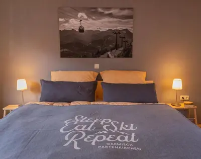 Ein Bett oder Betten in einem Zimmer der Unterkunft Papa Joe`s Ferienwohnung in Garmisch