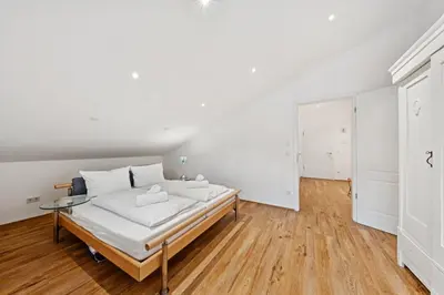 Ein Bett oder Betten in einem Zimmer der Unterkunft Vaicun Stays - Blick auf den Tegernsee