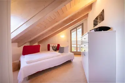 Ein Bett oder Betten in einem Zimmer der Unterkunft Partnachauen
