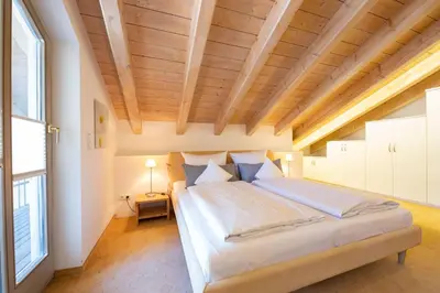 Ein Bett oder Betten in einem Zimmer der Unterkunft Partnachauen