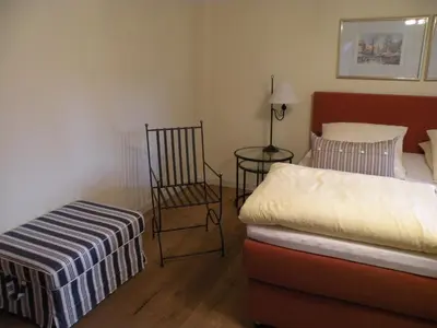 Ein Bett oder Betten in einem Zimmer der Unterkunft Alte Posthalterei Zorneding