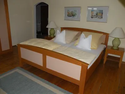 Ein Bett oder Betten in einem Zimmer der Unterkunft Alte Posthalterei Zorneding