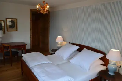 Ein Bett oder Betten in einem Zimmer der Unterkunft Alte Posthalterei Zorneding