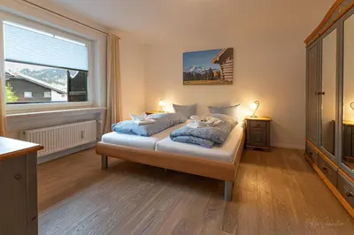 Ein Bett oder Betten in einem Zimmer der Unterkunft Fewo Karwendelspitzblick