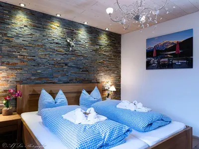 Ein Bett oder Betten in einem Zimmer der Unterkunft Fewo Isartraum