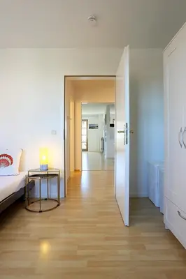 Ein Bett oder Betten in einem Zimmer der Unterkunft Ferienwohnung ARTE HAFEN