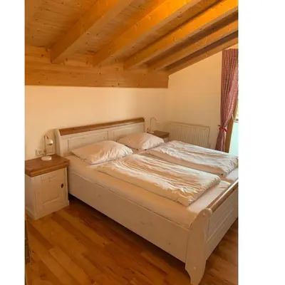 Ein Bett oder Betten in einem Zimmer der Unterkunft Feriendorf Via Claudia Ferienhaus Lechsee