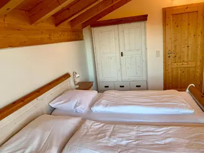 Ein Bett oder Betten in einem Zimmer der Unterkunft Feriendorf Via Claudia Ferienhaus Lechsee