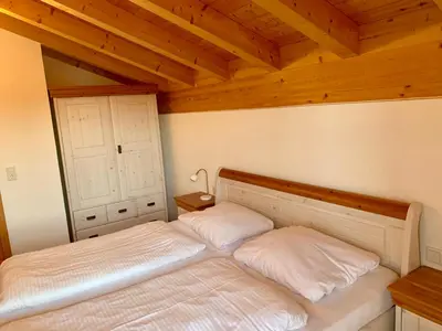 Ein Bett oder Betten in einem Zimmer der Unterkunft Feriendorf Via Claudia Ferienhaus Lechsee