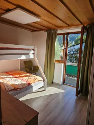 Ein Bett oder Betten in einem Zimmer der Unterkunft Ferienwohnung Alpencity