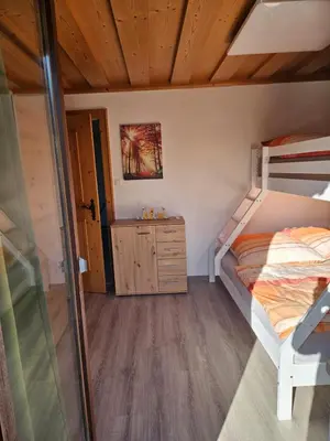 Ein Bett oder Betten in einem Zimmer der Unterkunft Ferienwohnung Alpencity